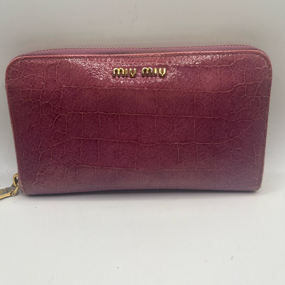 Miu Miu Handbags - Miu Miu  pink leather zippie wallet. Stunning